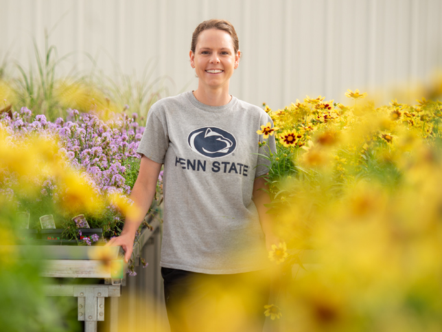 Employee surrounded by flowers