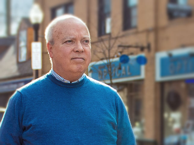 Penn State professor Tom Sharbaugh walks in downtown State College